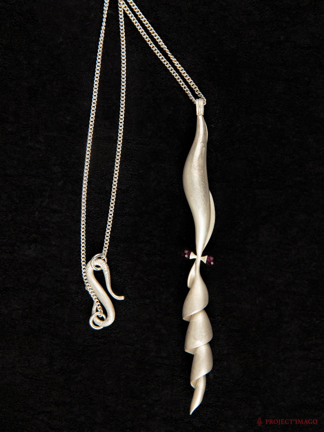 Albino Squid Pendant in Ruby